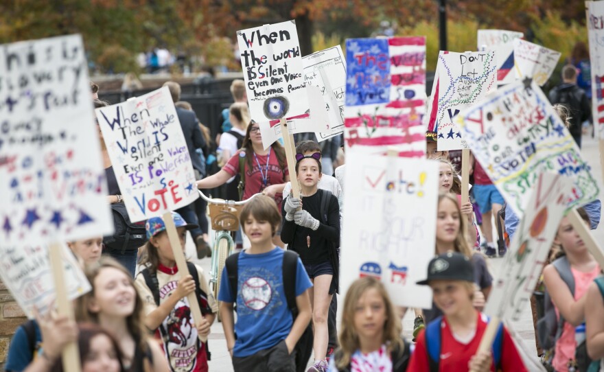 Ruby Lortie (center, wearing black), marches to get out the vote with other fifth-grade students from Boulder Community School of Integrated Studies in Boulder, Colo.