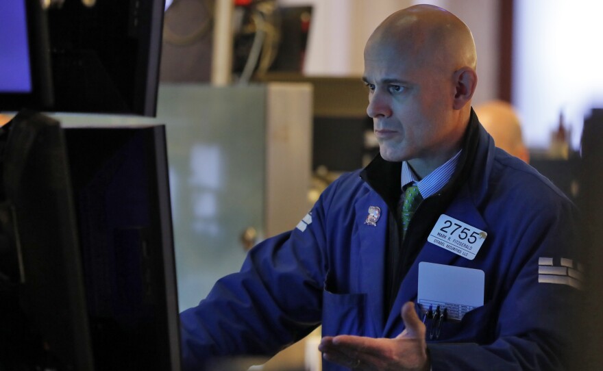 Specialist Mark Fitzgerald works on the floor of the New York Stock Exchange, Monday, Feb. 24, 2020. Markets are down across Europe, Asia, and the U.S. as the virus spreads to more countries around the world.