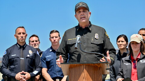 Orange County Fire Authority Division Chief Craig Covey speaks during a news conference at the Los Alamitos racetrack in Cypress, Calif., on Friday about a hazardous material situation in Garden Grove, Calif.