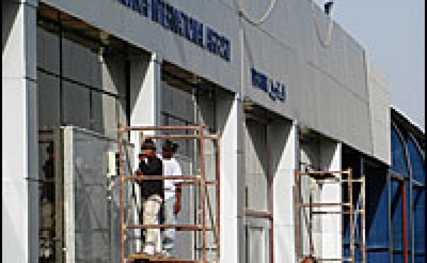 Workers put the finishing touches on Najaf's new international airport.