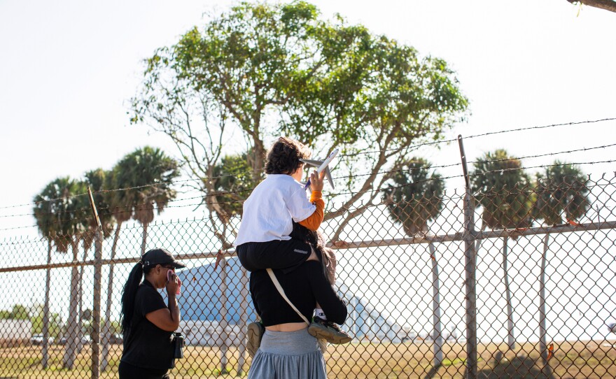 A small crowd gathered outside the airport's fence to bid Mundi farewell.