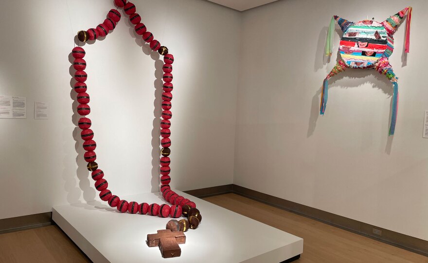 Two of Diana Benavídez's piñatas are shown installed at the Mingei on Apr. 10, 2023.