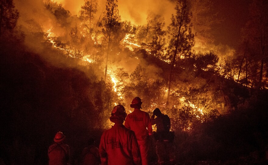 Firefighters work on the Ranch Fire, part of the Mendocino Complex Fire on Aug. 7. On Thursday Cal Fire asked state lawmakers for an additional $234 million in funding to continue battling wildfires through the end of the year.