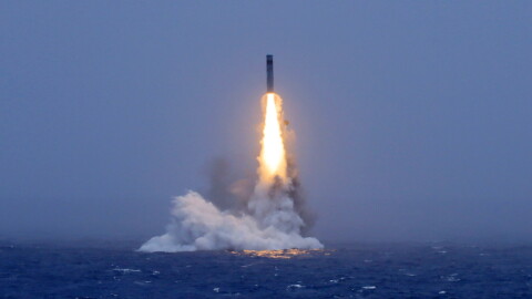 In this photo released by Xinhua News Agency, a long-range ballistic missile bursts out of the sea during a test launched from a Chinese nuclear-powered submarines in the South Pacific on Monday.