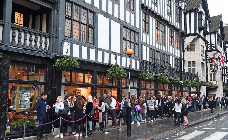 Customers form a line around the block at 8 a.m. for the launch of the 2017 Liberty London Beauty Advent Calendar in London in October 2017.