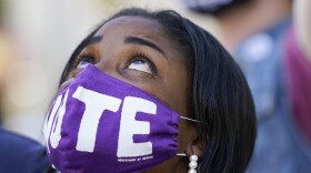 Janice Jamison, Evans, Ga, reacts after hearing the announcement by CNN that former vice president and Democratic presidential candidate Joe Biden had defeated Pres. Donald Trump, Saturday, Nov. 7, 2020