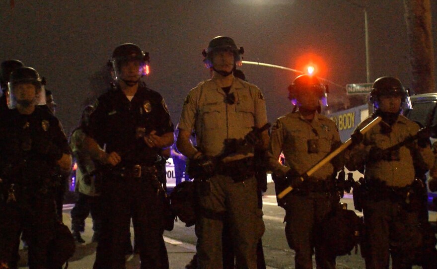 Outside National City council meeting, law enforcement in riot gear met protesters. July 24, 2018.