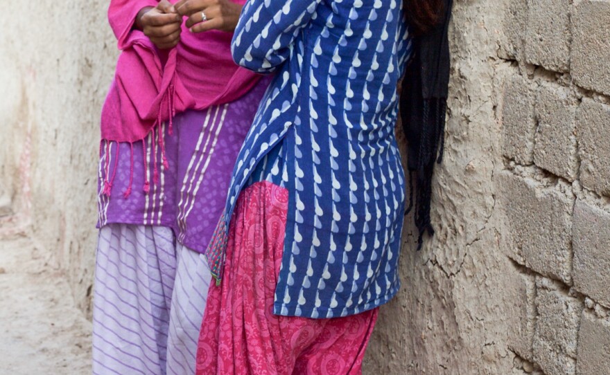 Durga (left) and her younger sister Nimmu. Last fall, we introduced Goats and Soda readers to Nimmu, married at age 10. She hadn't gone to live with her husband because she was in a boarding school to get an education. But she was struggling academically, and if she failed her next exam, she might be forced to drop out — and move in with her husband. The results are in, and Nimmu passed.