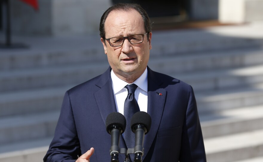 French President François Hollande speaks to the press at the Elysee Palace in Paris on Friday.