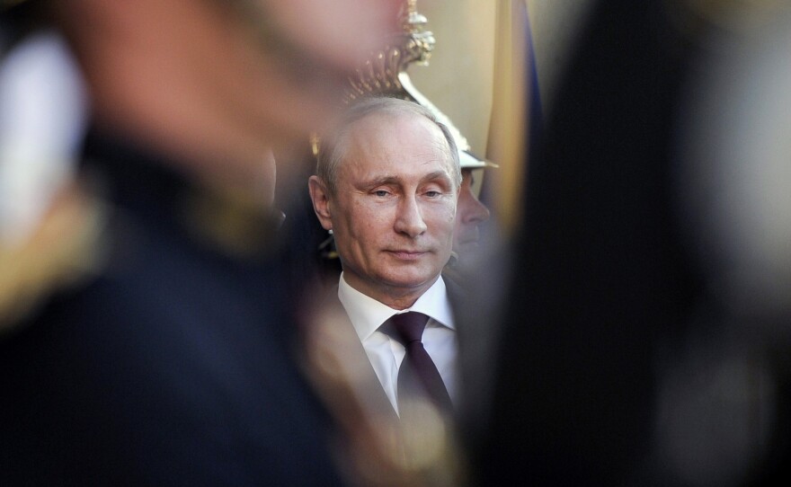 Russian President Vladimir Putin arrives at France's Elysee Palace in Paris in June for talks with French President Francois Hollande. Putin and far-right groups in Europe have been increasingly supportive of each other.