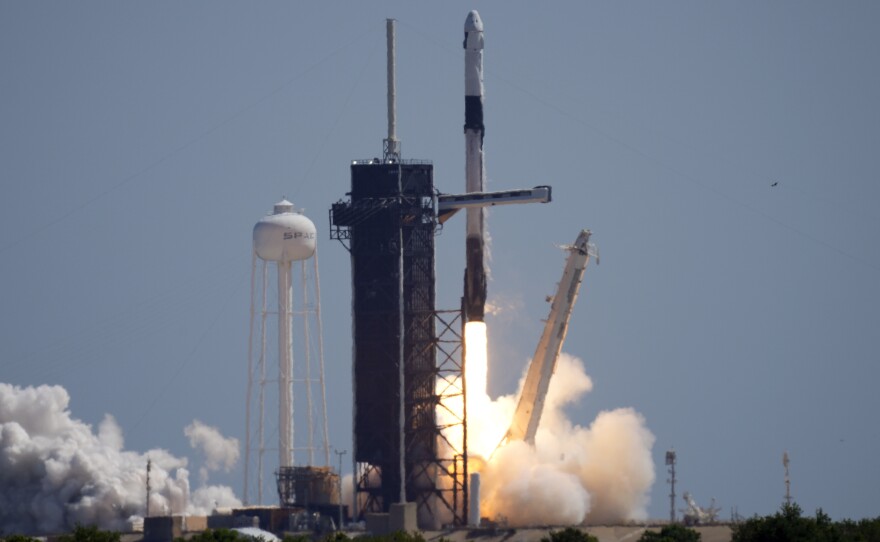 A SpaceX Falcon 9 rocket, with the Crew Dragon capsule attached, lifts off Friday at the Kennedy Space Center.