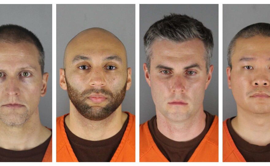 This combination of photos provided by the Hennepin County Sheriff's Office shows  (from left) Derek Chauvin,J. Alexander Kueng, Thomas Lane and Tou Thao. Lane's attorney on Wednesday filed a motion to dismiss charges against him.