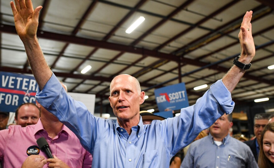 Florida Republican Senate candidate Gov. Rick Scott attends a rally at Skyline Attractions on Nov. 2 in Orlando, Fla.