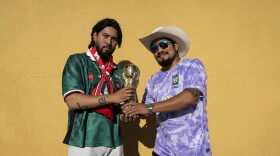 Josh Lee and Fernando Delgado hold a fake trophy outside the Biergarten in Los Angeles' Koreatown before the South Korea vs. Czech Republic World Cup game on June 11.