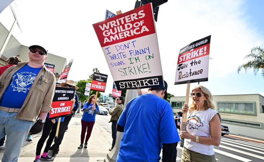 Writers walk the picket line on the second day of the television and movie writers strike outside Paramount Studios in Los Angeles on May 3.