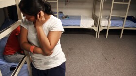 An Guatemalan woman is seen inside a dormitory in the Artesia Family Residential Center, a federal detention facility for undocumented immigrant mothers and children in Artesia, New Mexico, Sept. 10, 2014.
