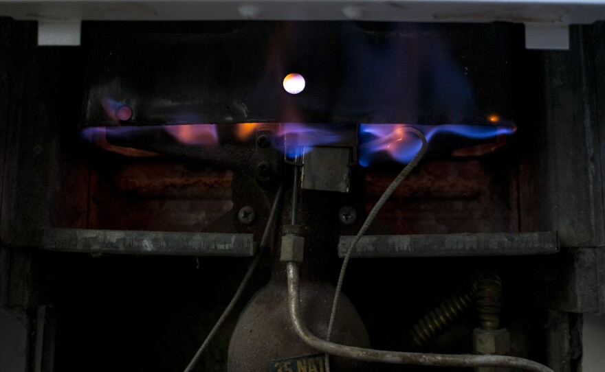 Natural gas burns in a home heater, Aug. 21, 2017.