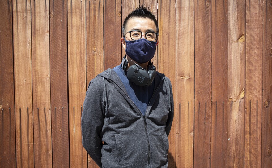 Jae Chung, 49, stands for a portrait outside the Marshall Security Training Academy & Range.