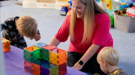 Jennifer Williams plays with her sons at home. She said leaving her job to care for her sons was a difficult call to make, but it was the right one for her family.