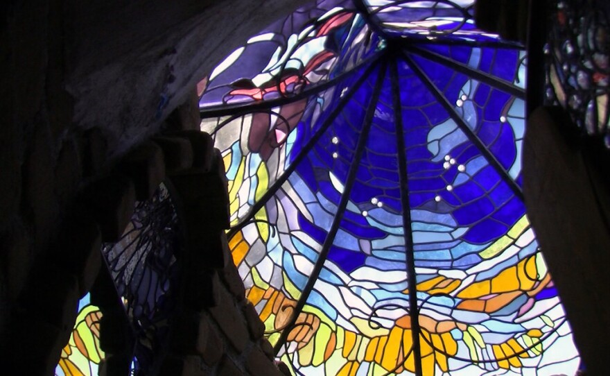 Stained glass designed by artist Jim Hubbell adorns one of the buildings on his Julian property, April 11, 2017.