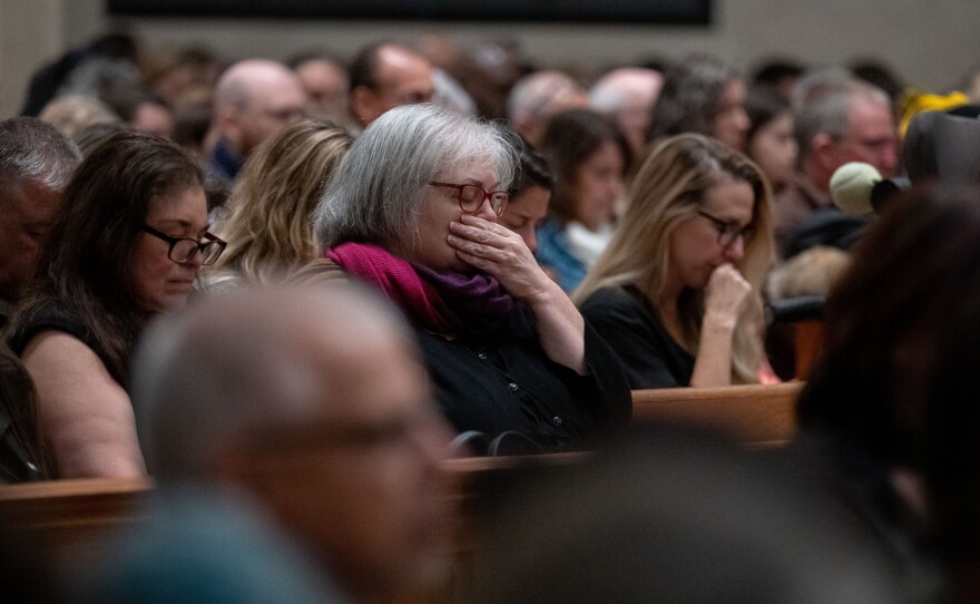 Attendees listen to speakers in the Basilica of Saints Peter and Paul in Lewiston, Maine.