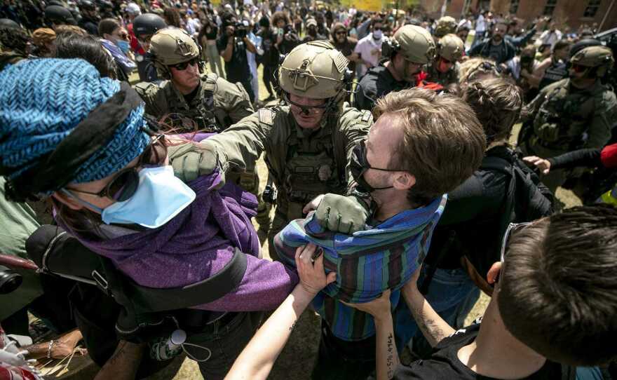 Officers surrounded the camp on the Tivoli Quad and began attempting to remove the two dozen or so people who refused to clear out at the Auraria Campus.