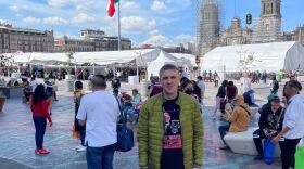 Sergei Sviderskii stands in the Zocalo in Mexico City on Oct. 12, 2022, before traveling to the border in Tijuana to seek asylum.