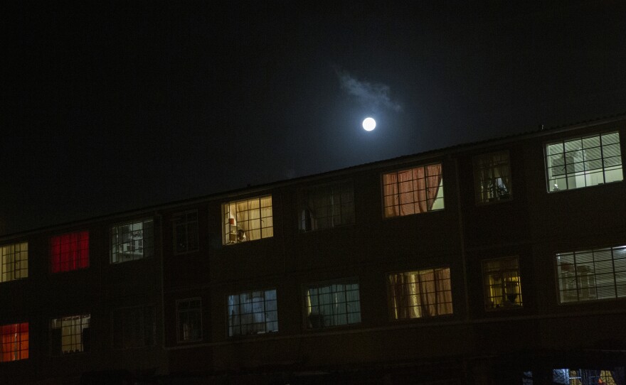 A full moon rising over Manenberg. 2018.