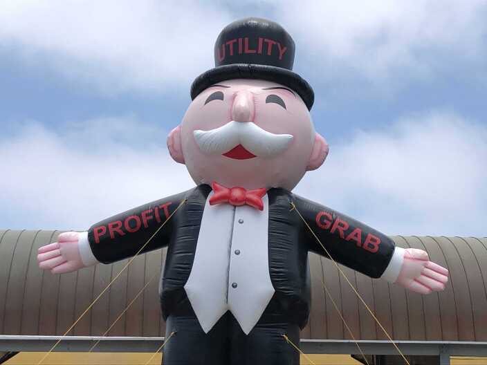 Community solar advocates rally at the Chula Vista Library Wednesday to protect the state's rules for rooftop solar customers on Jun. 2, 2021.