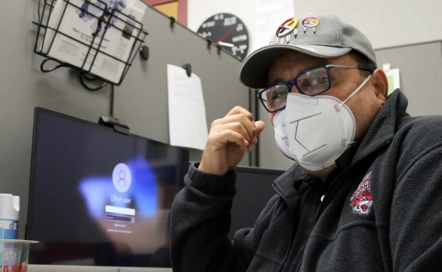 In this undated photo, Benjamin Duarte sits in his office wearing an N95 mask.