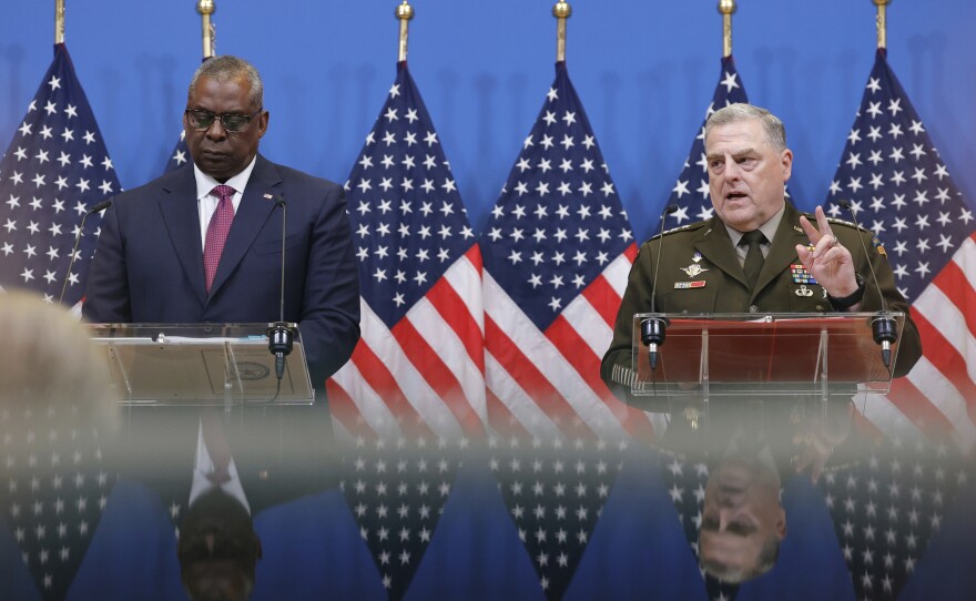 U.S. Defense Secretary Lloyd Austin (left), and U.S. Chairman of the Joint Chiefs of Staff, General Mark Milley speak at NATO headquarters in Brussels on Wednesday. The NATO defense ministers are meeting to discuss the war in Ukraine. The U.S. announced an additional $1 billion in military aid to Ukraine, which includes heavy weapons.