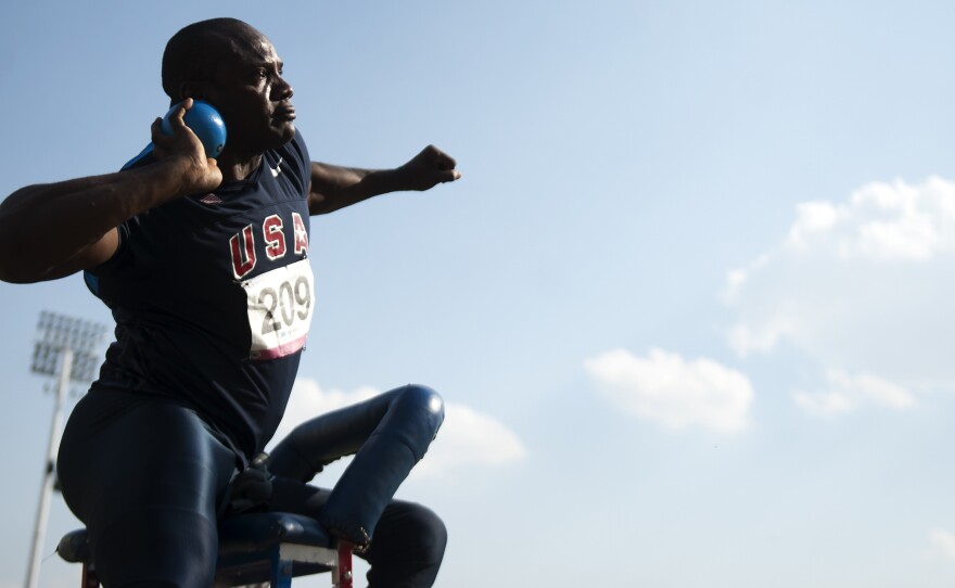 Dennis Ogbe practiced by throwing rocks and auto parts — and now is a world-class shot-putter among athletes with disabilities. Above, he competes in the Parapan American Games.
