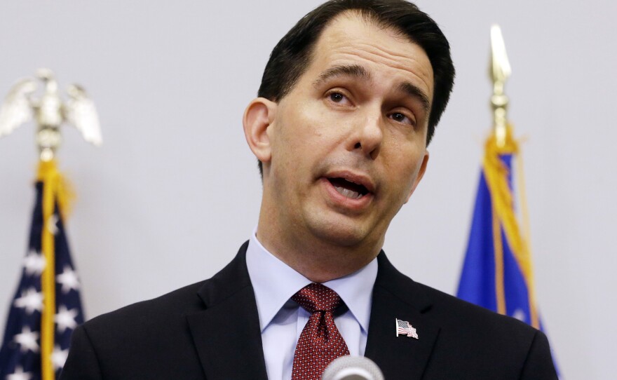 Wisconsin Gov. Scott Walker announces he is suspending his presidential campaign at a news conference in Madison in September.