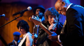 Mick Jagger sings and Buddy Guy plays guitar as President Barack Obama and First Lady Michelle Obama host IN PERFORMANCE AT THE WHITE HOUSE "Red, White and Blues” in celebration of blues music in the East Room of the White House, Feb. 21, 2012. The concert is in recognition of Black History Month. In the background, from left, music director and band leader Booker T. Jones, Jeff Beck and Gary Clark Jr. joined in for the song. 