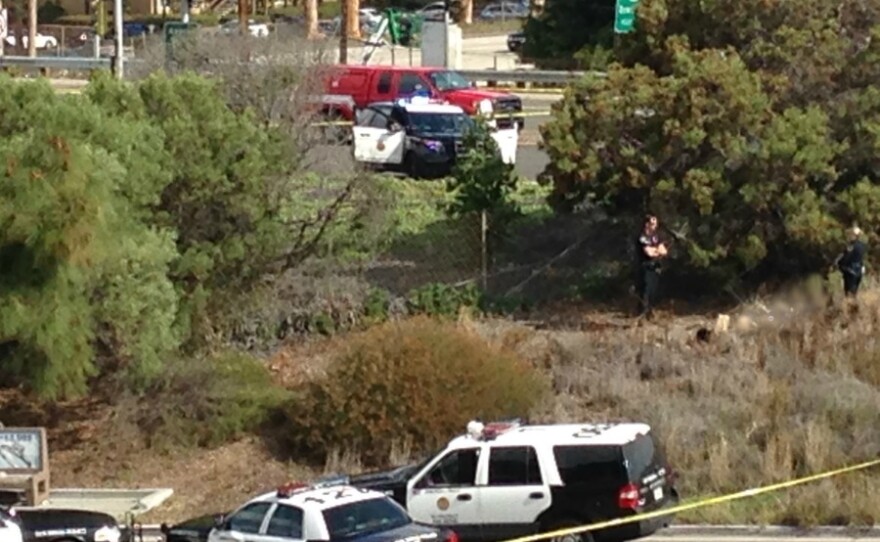 San Diego police investigate in Kearny Mesa near Interstate 805 and state Route 163 after officers shot and killed a gunman. An officer also was shot and was taken to nearby Sharp Memorial Hospital. She is expected to survive.