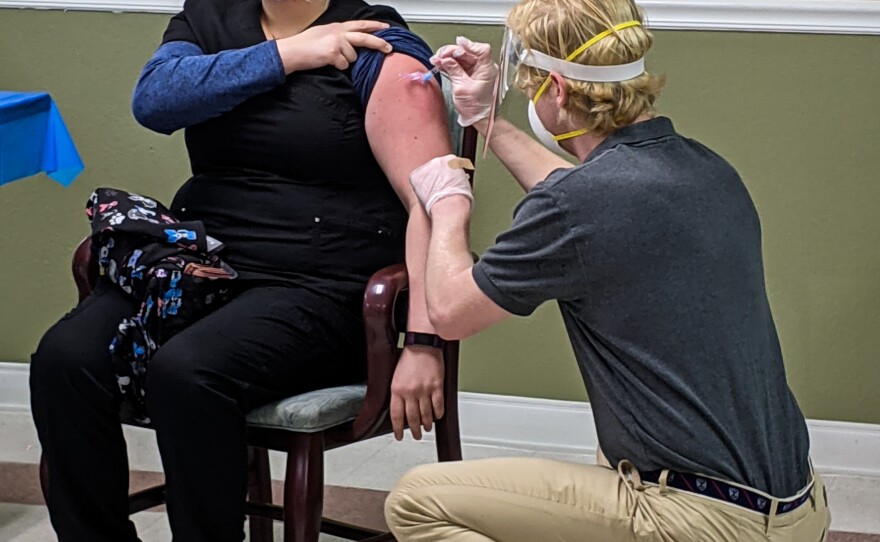Josiah Howard (right) was one of two CVS pharmacists who administered the Moderna COVID-19 vaccine to staff members and residents at the Brian Center/Cabarrus nursing home on Jan. 14, 2021.