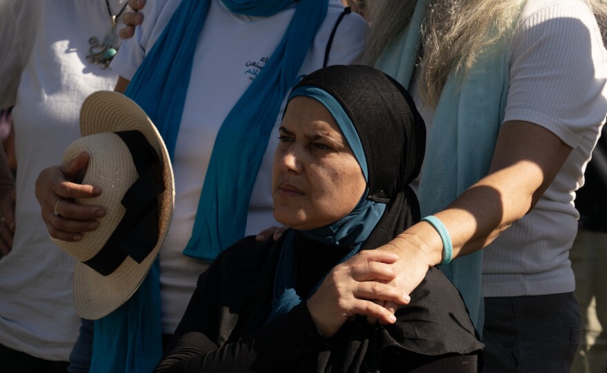 Mourners listen to eulogies for Vivian Silver during her funeral service Thursday.