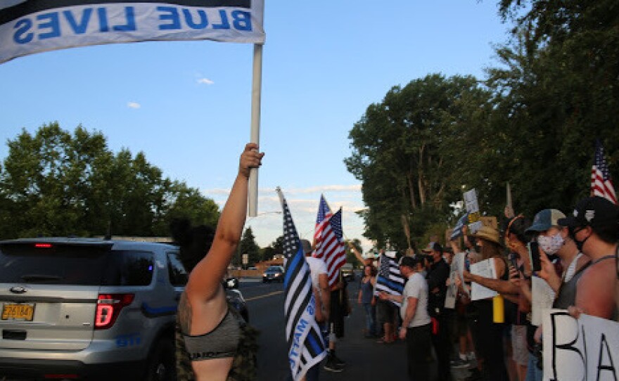 Black Lives Matter protesters in Prineville, Ore., face off with counter-protesters after an online argument between the one protester and the police chief.