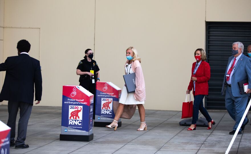 Republican National Convention delegates arrive at the Charlotte Convention Center on Sunday.
