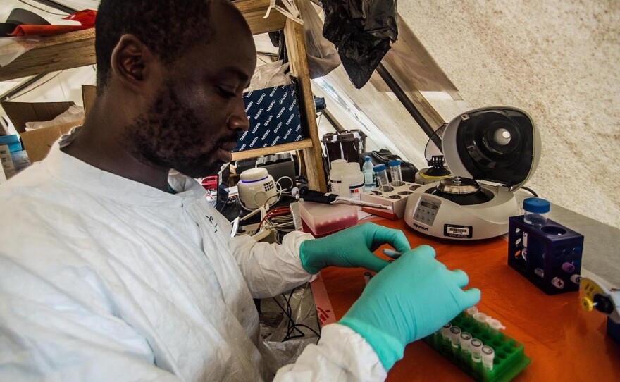 A technician tests patient samples for Ebola at a field lab run by Doctors Without Border in Kailahun, Sierra Leone.