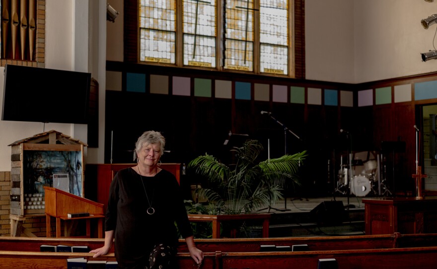 Executive Pastor Pam Pangborn stands inside Hope Community Church in Detroit. The church had installed five back-flow valves to prevent flooding but the force of the water on June 26 overwhelmed them and flooded the church basement.