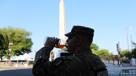 National stand guard near the Washington Monument at the national mall, during an Independence Day event honoring the nation's 250th anniversary on Saturday.