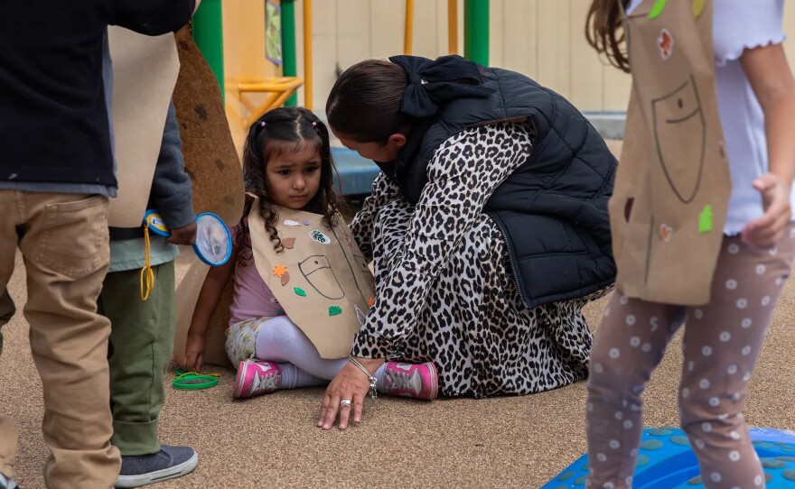 Teacher Viviana Vasquez comforts a student during a safari hunt. The preschool has eight teachers, two on-site therapists and a behavioral therapist on staff. While therapists mainly focus on the mental health of a student, behavioral therapists center on examining the actions and conduct of a student to see what may be triggering them or getting in the way of them interacting with others, taken in San Diego on April 23, 2025.