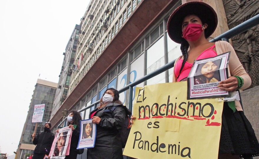 Demonstrators in front of the prosecutor's office in Lima, Peru, protest gender violence and femicide on June 20.