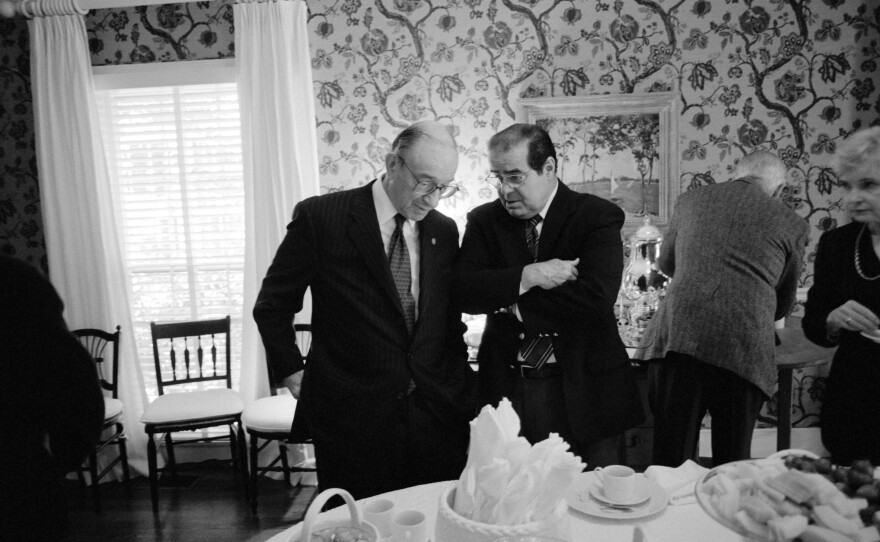 Chairman of the Federal Reserve Board Alan Greenspan (left) and Justice Antonin Scalia talk during a gathering for John E. Robson, President and Chairman of the Export-Import Bank of the United States, at Secretary of Defense Donald Rumsfeld's home in 2001.