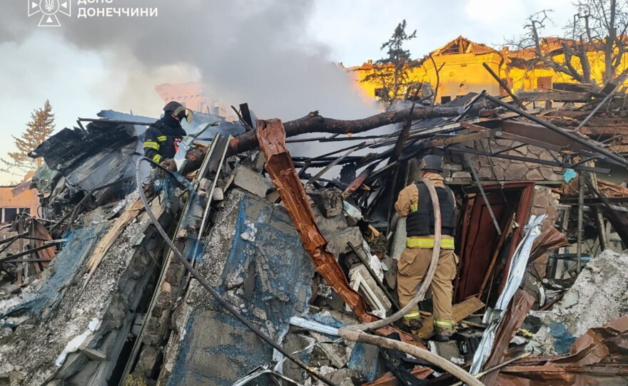 In this photo provided by the Ukrainian Emergency Service, emergency services personnel work to extinguish a fire following a Russian guided bomb strike in the city center of Sloviansk, Donetsk region, Ukraine, Monday, Aug. 31, 2026.