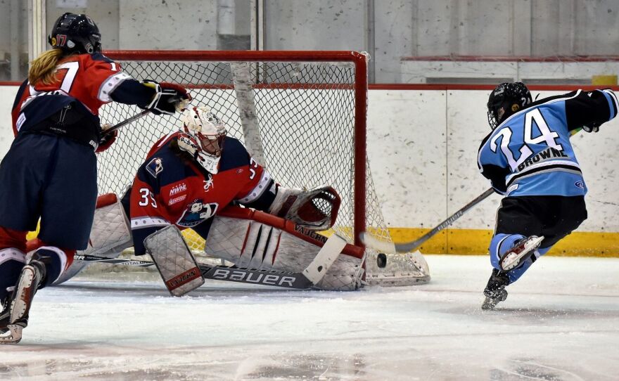 Harrison Browne shoots during a Buffalo Beauts match.
