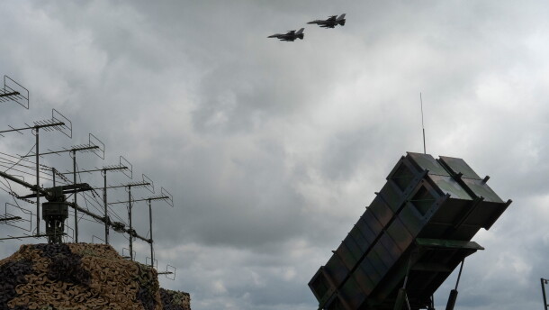 Ukrainian Air Force F-16 fighter jets fly over a Patriot air and missile defense system in an undisclosed location in Ukraine, on Aug. 4, 2024.