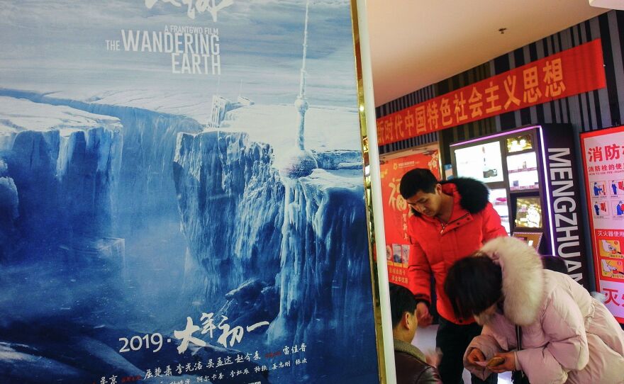 The Wandering Earth has rocketed to second place on China's all-time box office list. A poster for the film is seen in the Chinese city of Yichang earlier this month.