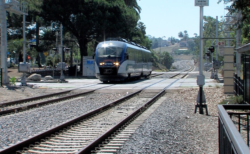 A North County Transit District SPRINTER train crossing Vista Village Drive, a busy corridor in Vista, Calif, Aug. 29, 2023.